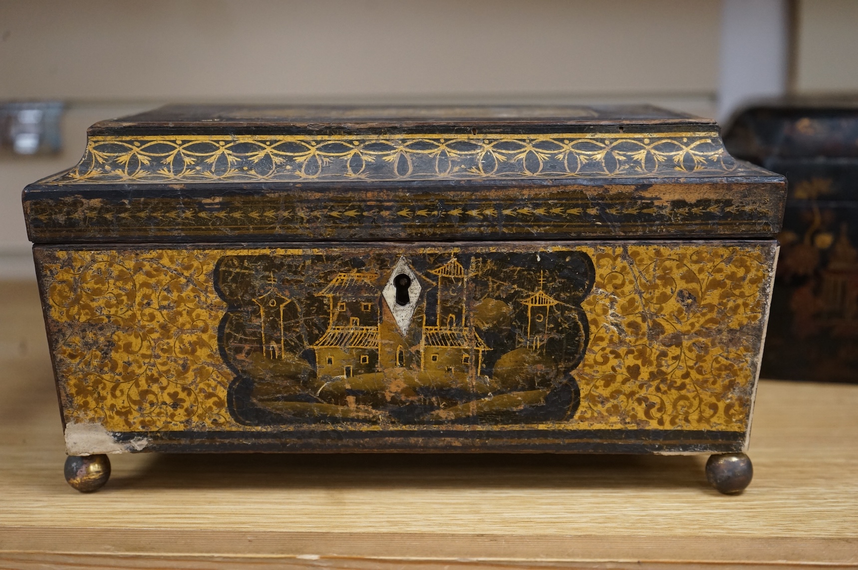 A Chinese lacquer tea caddy and a japanned sewing box (2)